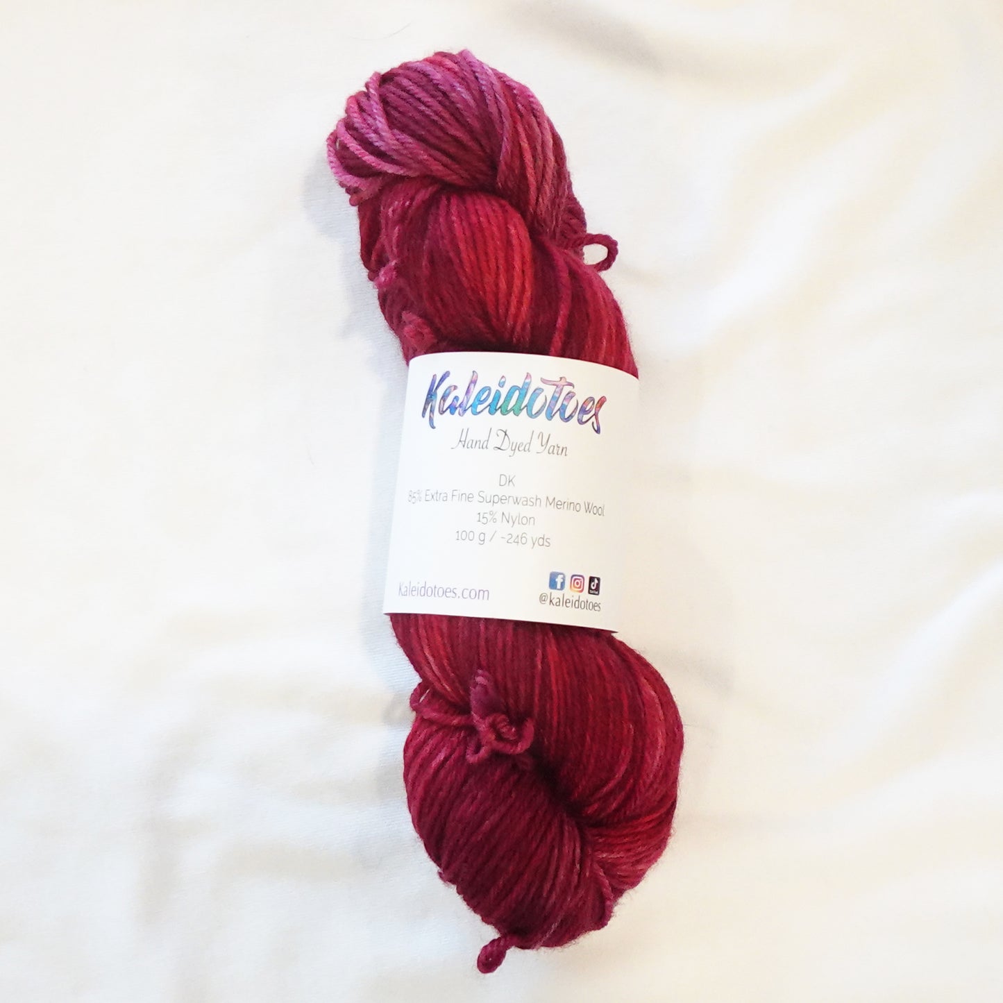 Hand-dyed yarn in deep garnet red tonal shades with rich wine undertones and dramatic jewel-like depth, inspired by Egyptian royalty and ancient dynasties.
