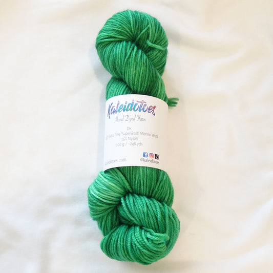 Hand-dyed yarn in deep emerald green tonal shades with rich jewel-like depth, inspired by Egyptian royalty and hidden treasure vaults.