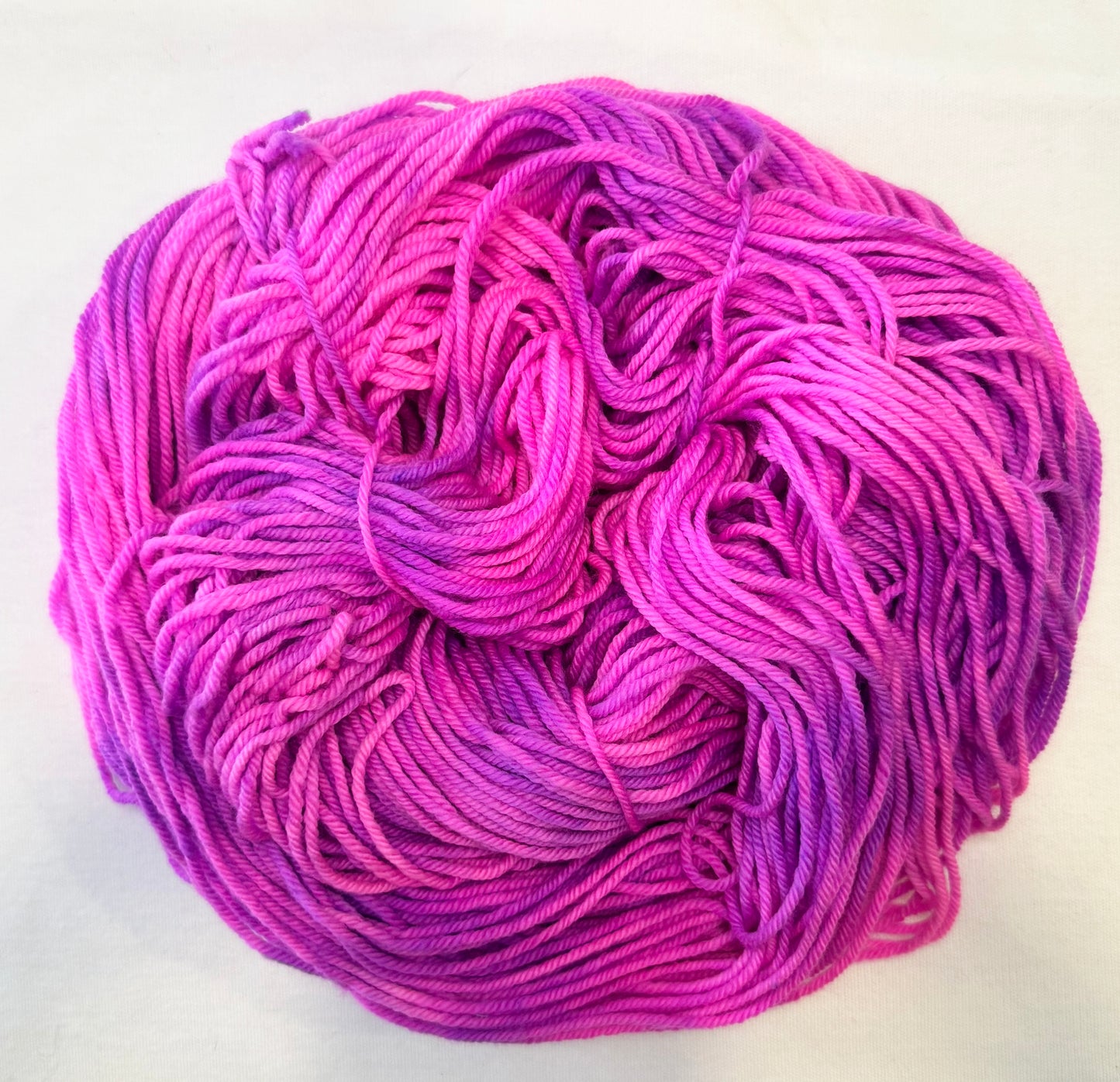and-dyed yarn in vivid pink and orchid tones — playful and bright and candy-sweet.