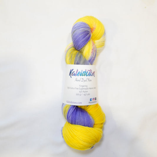 Hand-dyed yarn in bright yellow, lavender, and violet tones — fresh and vibrant with a soft, citrus-inspired feel.