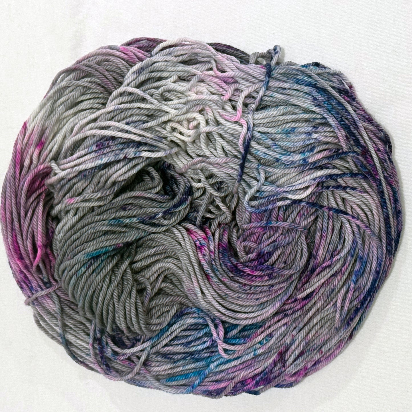 Speckles in Shadows yarn in grey with colorful speckles