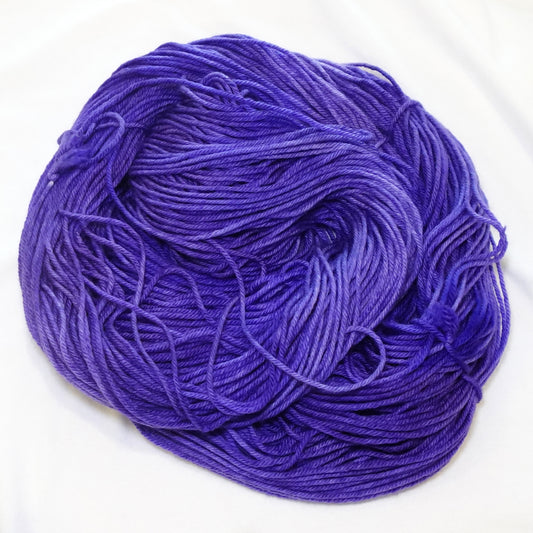 Hand-dyed_DK_weight_yarn_in_deep_royal_purple_with_subtle_tonal_variation_rich_bold_and_regal.