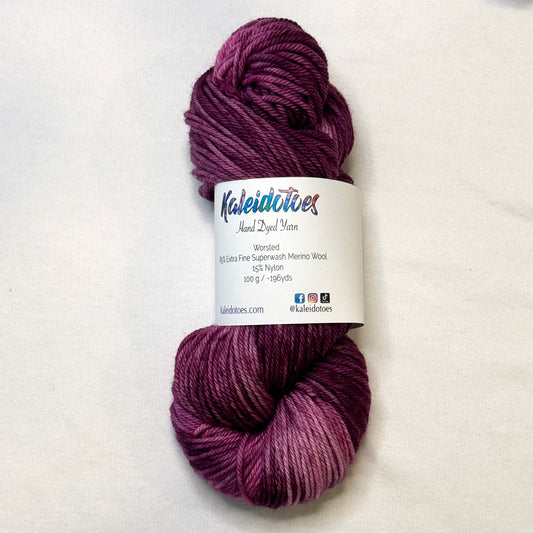 Hand-dyed yarn in deep berry, plum, and rose tones --rich, glamorous, and tonal.