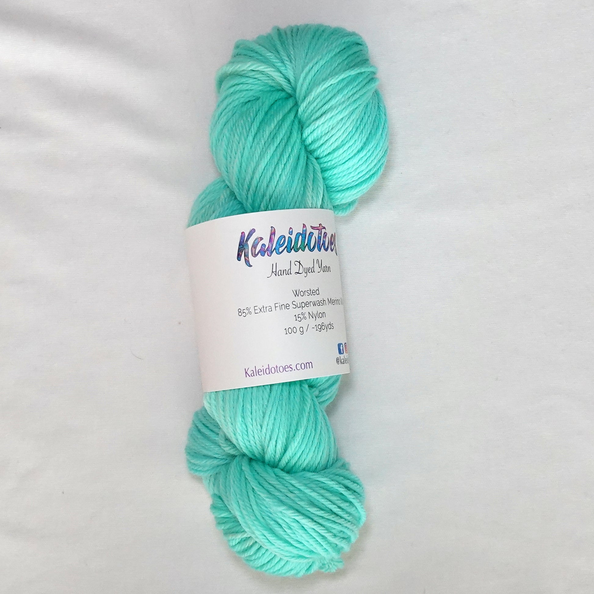 Hand-dyed worsted weight yarn in fresh mint and aqua tones - clean, cool, and luminous throughout.