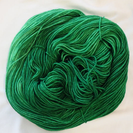Hand-dyed yarn in deep emerald green tonal shades with rich jewel-like depth, inspired by Egyptian royalty and hidden treasure vaults.