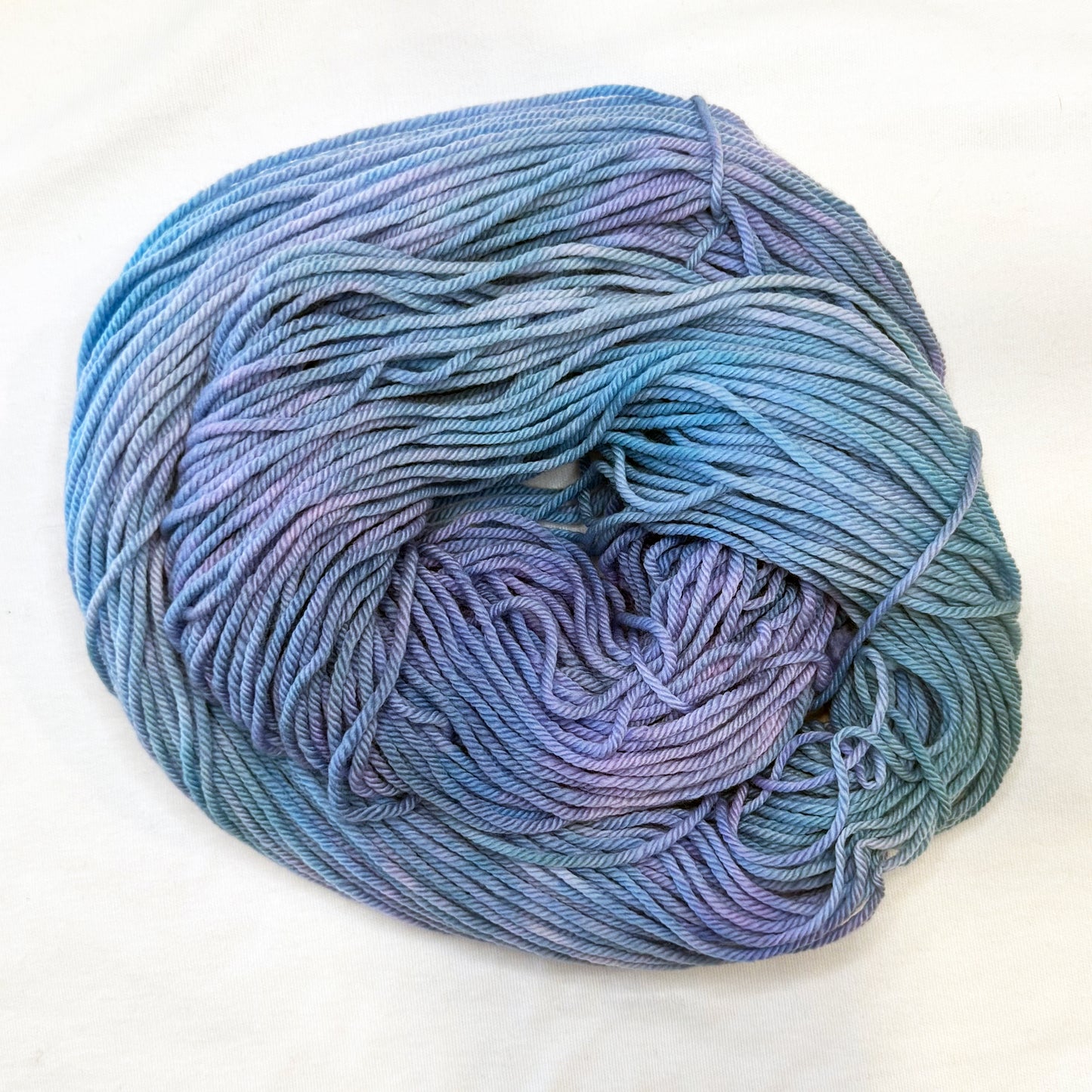 Hand-dyed yarn in soft periwinkle, lavender, and misty blue — tranquil and airy like a clear morning sky.