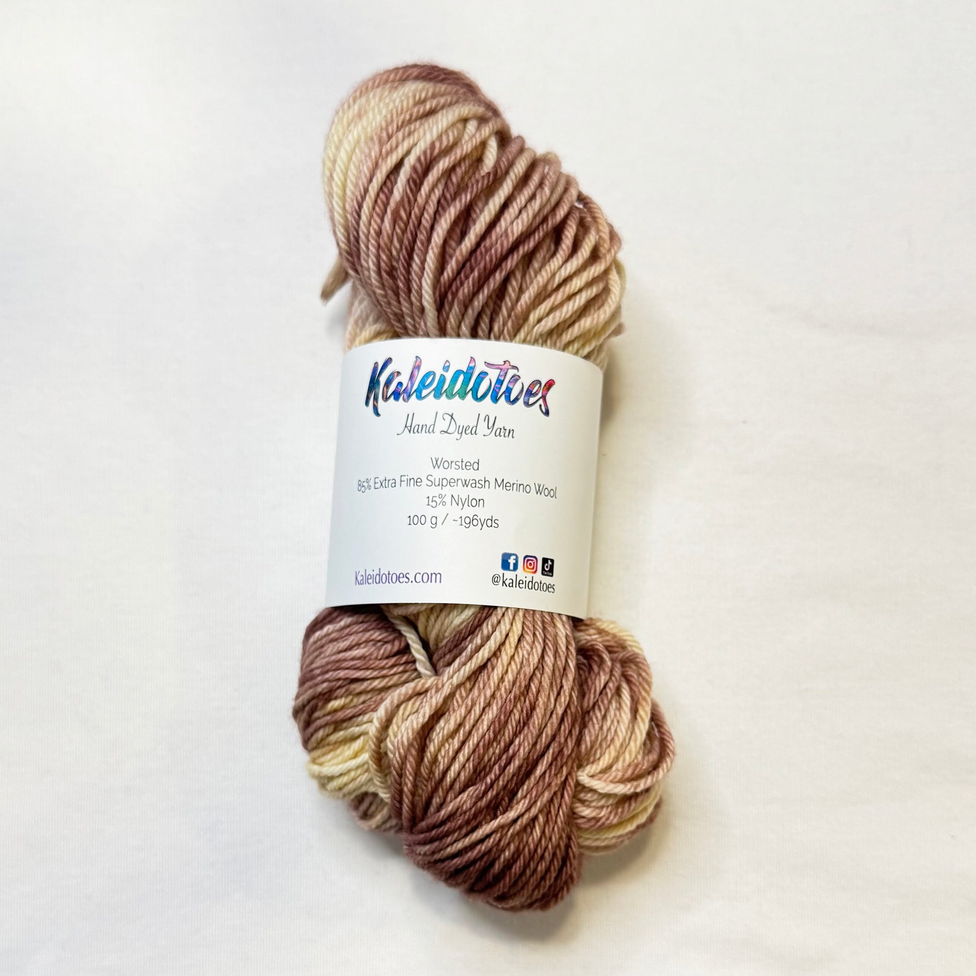 Hand-dyed yarn in soft grey, taupe, and birch-inspired woodland neutrals with a calm winter feel.