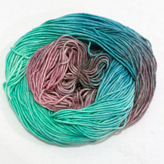 Mint turquoise, pink and lavender in a swril - worsted weight yarn
