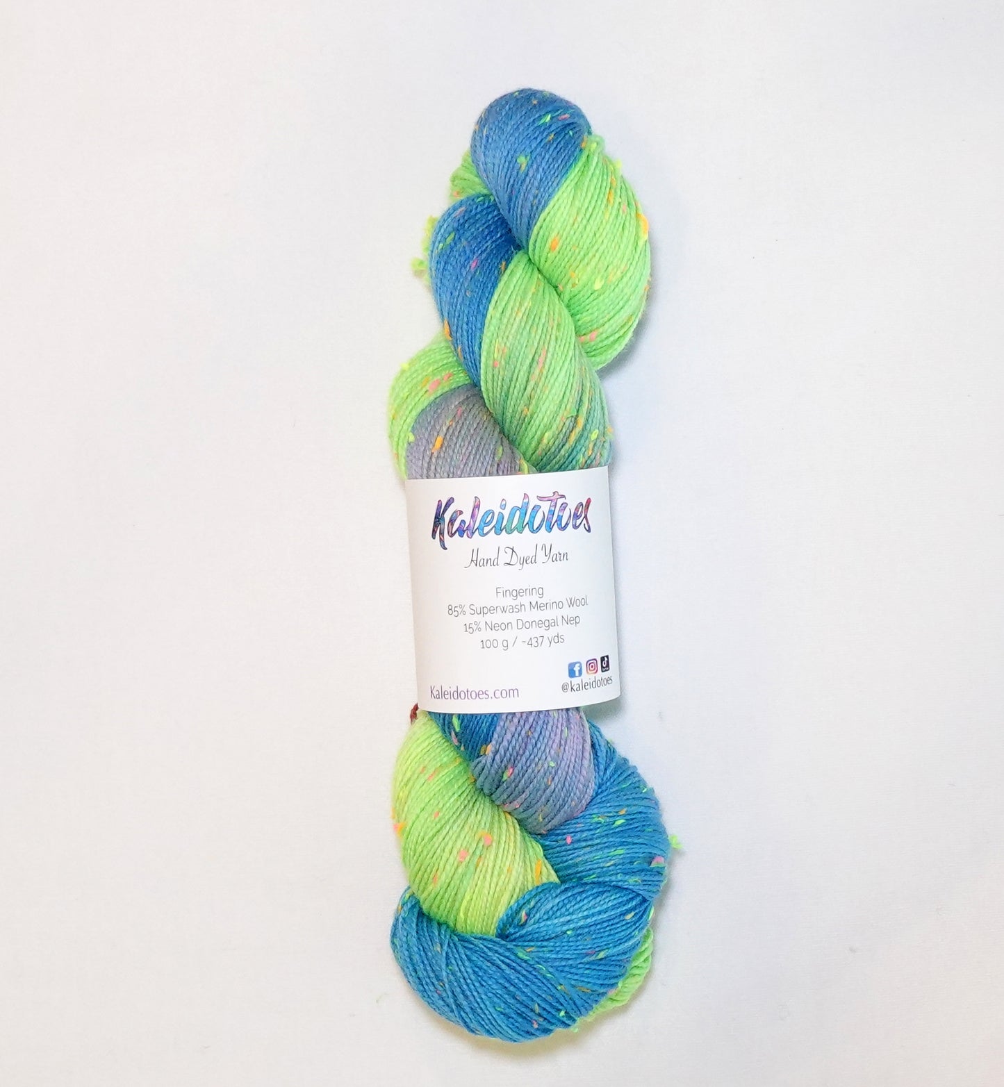 Hand-dyed yarn in bright blue, neon lime, and lavender tones with colorful neon flecks — vibrant, playful, and full of confetti-like energy.