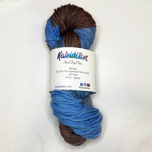 Hand-dyed yarn in weathered denim blue and warm brown tones — rustic, relaxed, and full of cozy charm.