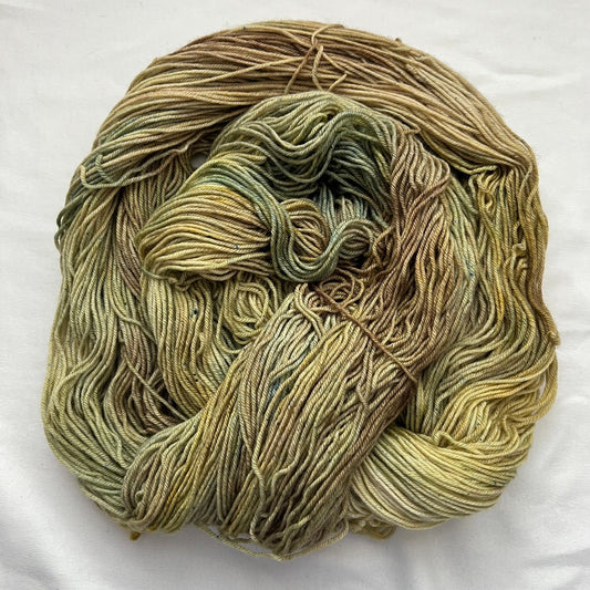 Hand-dyed sock yarn in sage green, beige, straw, and mossy undertones, Shades of Sage colorway